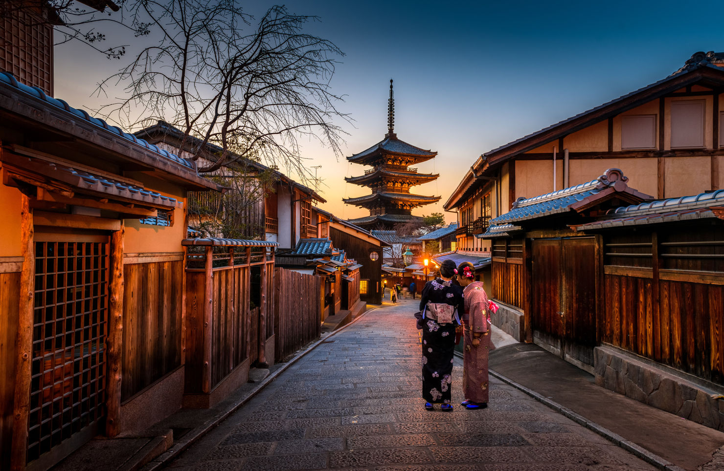 A small street in a historic Japanese town at dusk